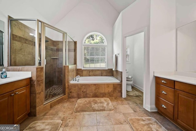 7198 Golfside Dr SE, Covington, GA 30014 - full bath featuring a shower stall, a bath, vanity, and lofted ceiling
