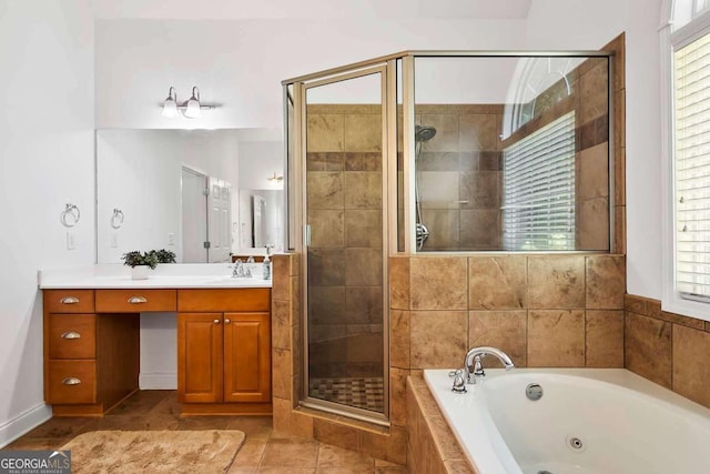 7198 Golfside Dr SE, Covington, GA 30014 - bathroom with vanity, a tub with jets, a shower stall, and tile patterned floors