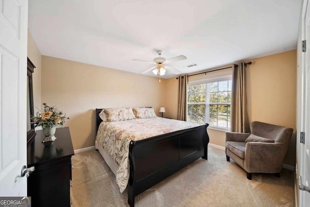 7198 Golfside Dr SE, Covington, GA 30014 - bedroom featuring light colored carpet and a ceiling fan
