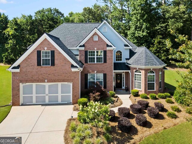 7198 Golfside Dr SE, Covington, GA 30014 - traditional-style home featuring brick siding, driveway, and a front yard