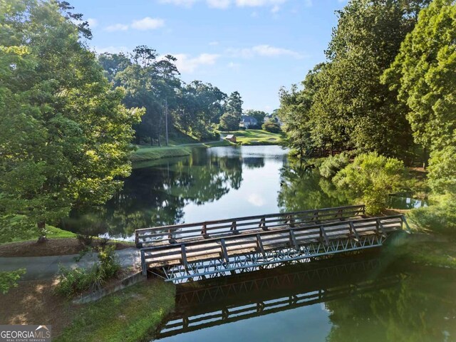 7198 Golfside Dr SE, Covington, GA 30014 - dock featuring a water view