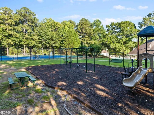 7198 Golfside Dr SE, Covington, GA 30014 - communal playground featuring a tennis court