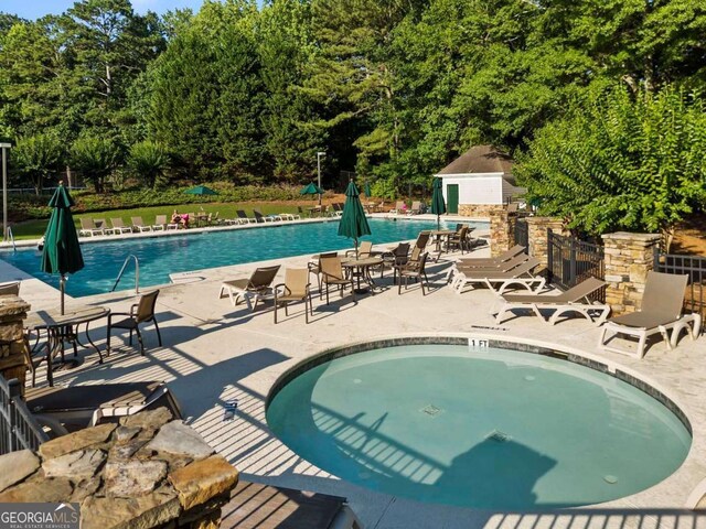 7198 Golfside Dr SE, Covington, GA 30014 - community pool with a patio area