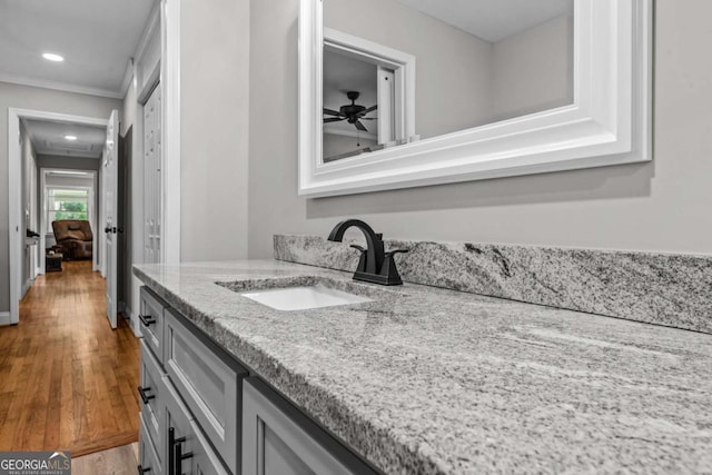195 Sylvan Rd, Athens, GA 30606 - bathroom with vanity, crown molding, wood finished floors, recessed lighting, and a ceiling fan