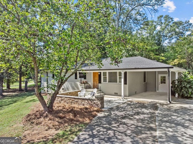 195 Sylvan Rd, Athens, GA 30606 - single story home with asphalt driveway, an attached carport, a front yard, a shingled roof, and brick siding