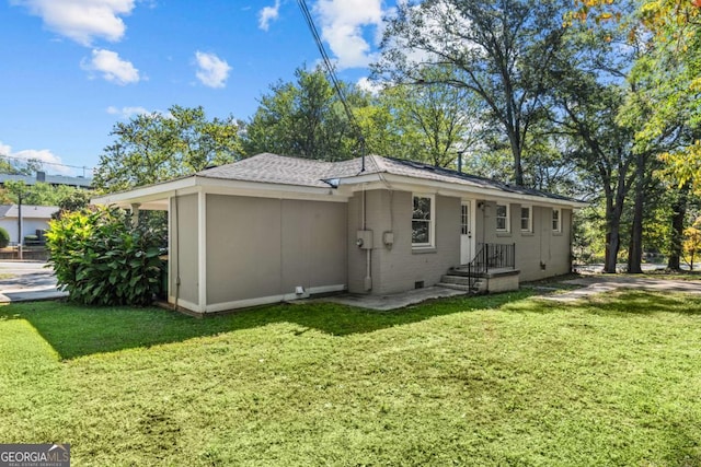 195 Sylvan Rd, Athens, GA 30606 - rear view of house featuring a lawn, roof with shingles, and crawl space