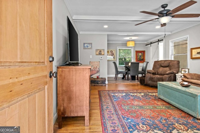 195 Sylvan Rd, Athens, GA 30606 - living room featuring a barn door, wood finished floors, crown molding, ceiling fan, and recessed lighting