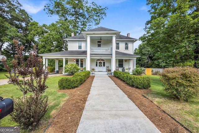205 Cobb St, Palmetto, GA 30268 - neoclassical home featuring a porch, a chimney, ceiling fan, a balcony, and a shingled roof