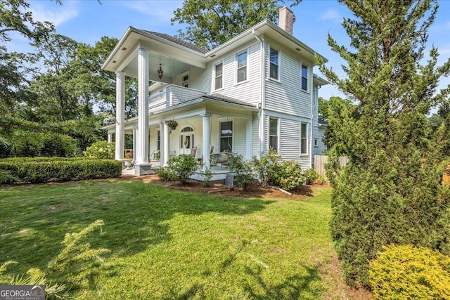 205 Cobb St, Palmetto, GA 30268 - view of front facade featuring covered porch, a chimney, and a balcony