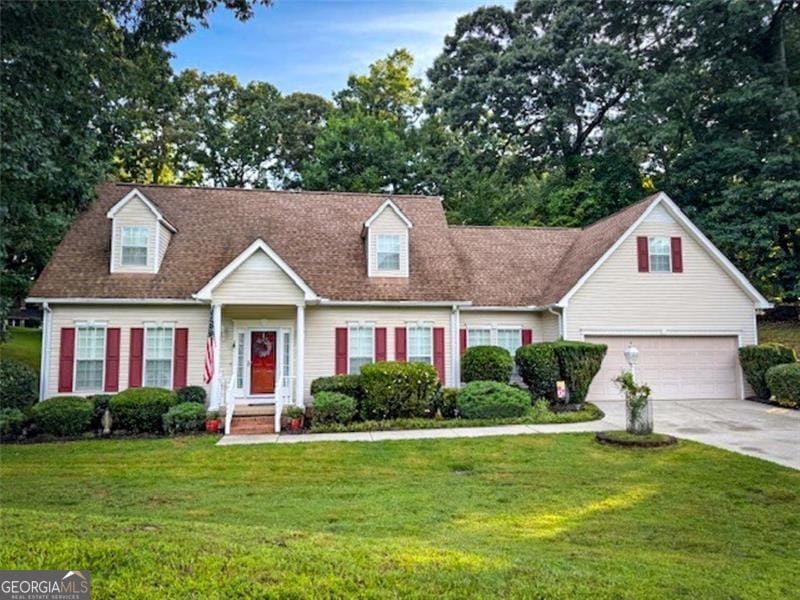 2503 N Oaks, Gainesville, GA 30506 - cape cod-style house with driveway, a front yard, and an attached garage