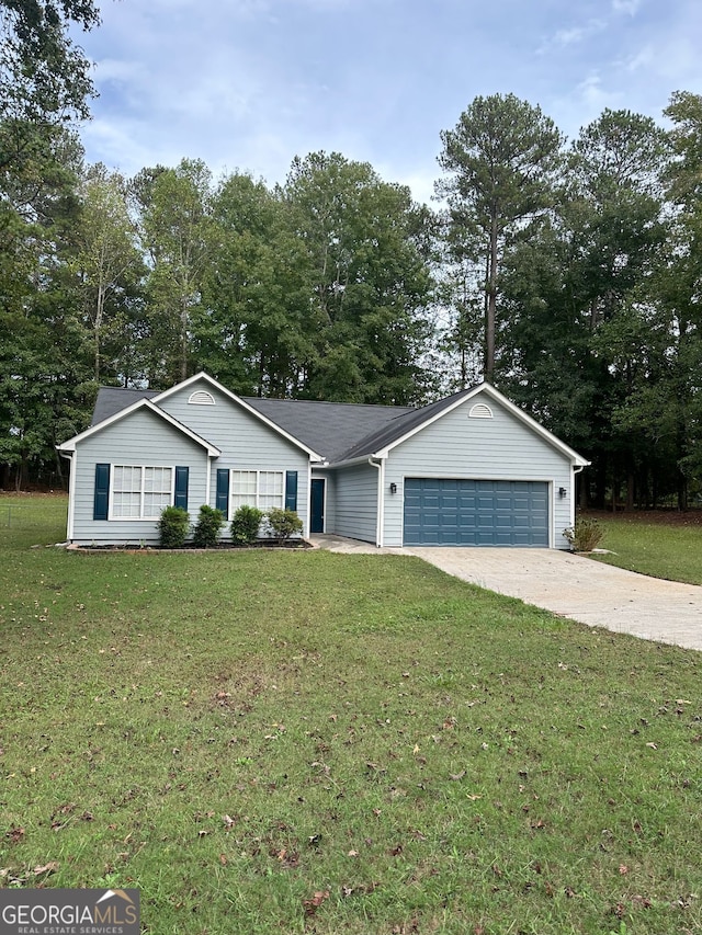 750 Flintlock Dr, Dacula, GA 30019 - ranch-style home with a garage, driveway, a front lawn, and view of scattered trees