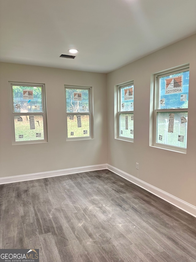 750 Flintlock Dr, Dacula, GA 30019 - unfurnished room with dark wood finished floors and baseboards