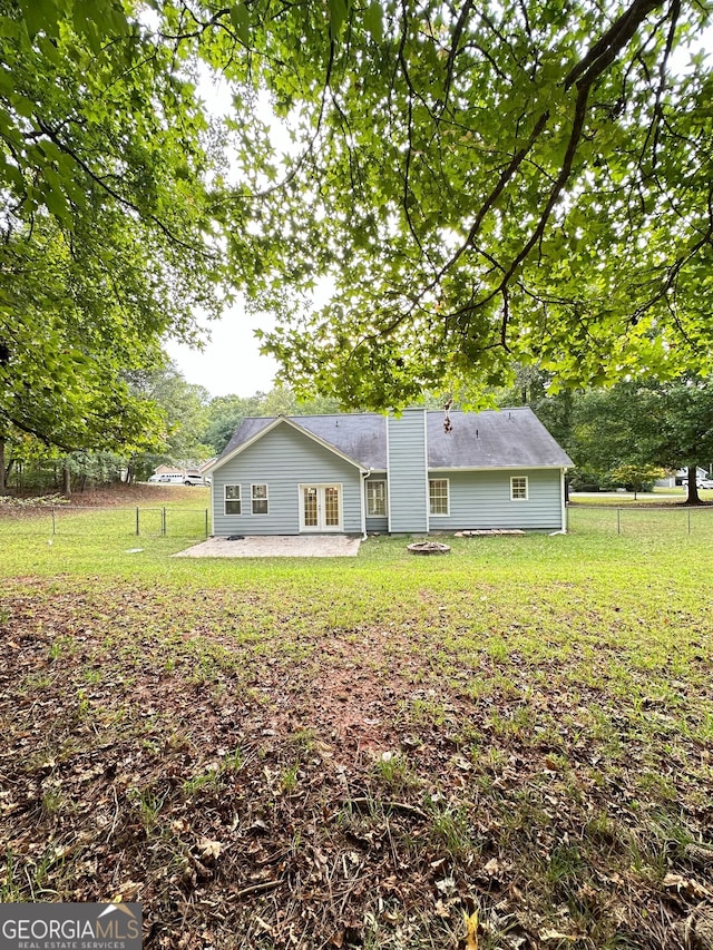 750 Flintlock Dr, Dacula, GA 30019 - back of property with a patio and a chimney