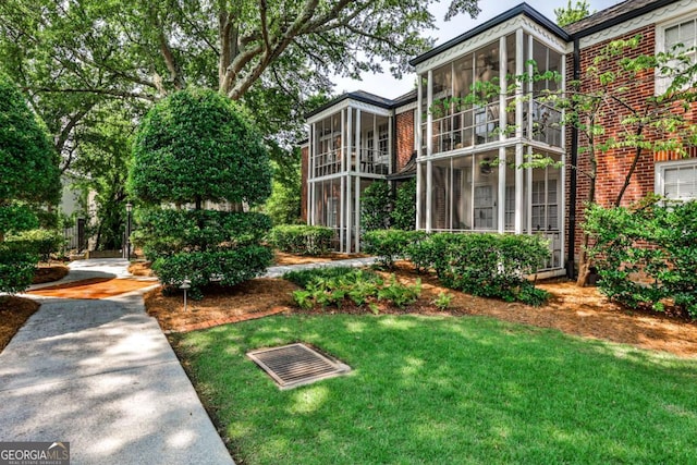 55 Delmont Dr NE Unit C3, Atlanta, GA 30305 - view of green lawn featuring a sunroom