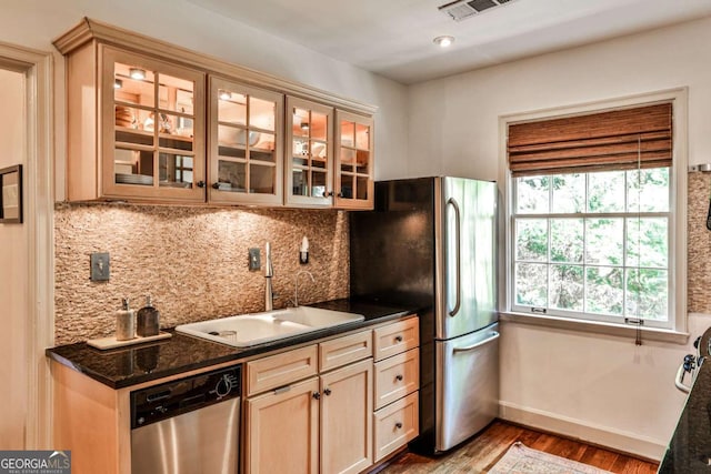 55 Delmont Dr NE Unit C3, Atlanta, GA 30305 - kitchen featuring stainless steel appliances, wood finished floors, glass insert cabinets, tasteful backsplash, and light brown cabinetry