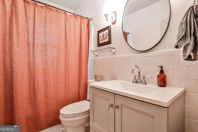 55 Delmont Dr NE Unit C3, Atlanta, GA 30305 - full bathroom with tile walls, vanity, curtained shower, and a wainscoted wall