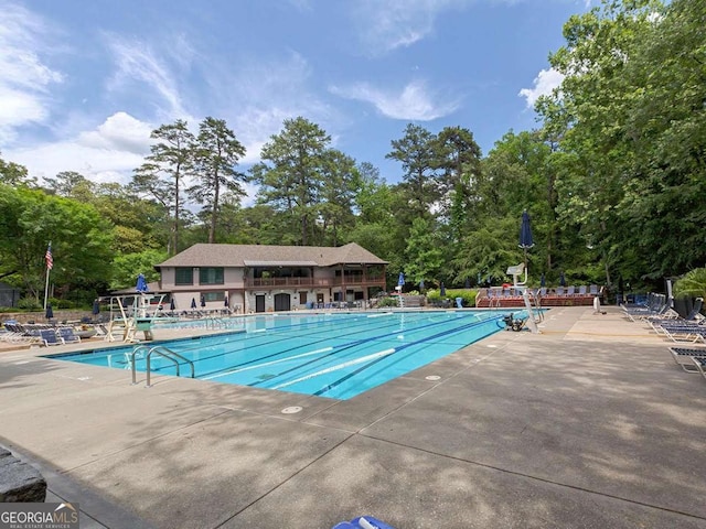 55 Delmont Dr NE Unit C3, Atlanta, GA 30305 - community pool with view of wooded area and a patio