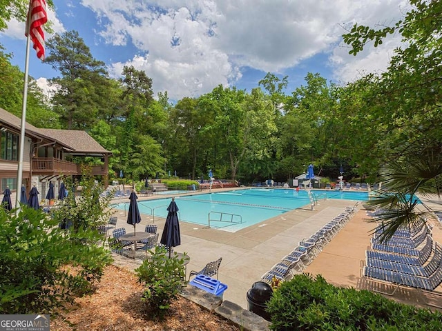 55 Delmont Dr NE Unit C3, Atlanta, GA 30305 - community pool with a patio area and view of scattered trees
