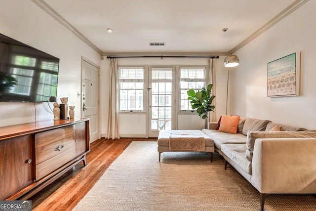 55 Delmont Dr NE Unit C3, Atlanta, GA 30305 - living room featuring crown molding and light wood finished floors