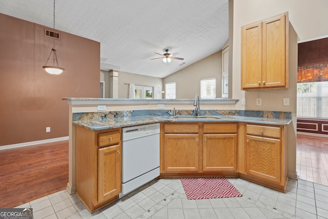 377 Avian Forest Dr, Stockbridge, GA 30281 - kitchen with white dishwasher, a textured ceiling, a ceiling fan, light tile patterned floors, and a peninsula