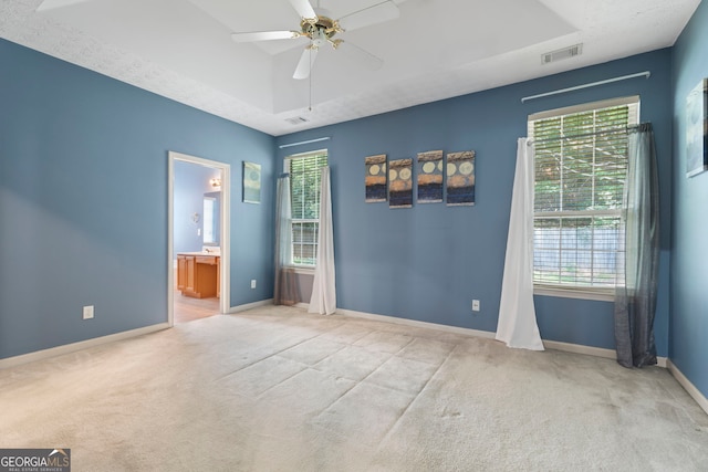 377 Avian Forest Dr, Stockbridge, GA 30281 - unfurnished bedroom with carpet, ensuite bathroom, and ceiling fan