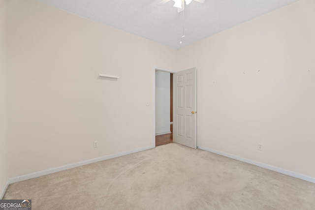 377 Avian Forest Dr, Stockbridge, GA 30281 - empty room featuring light carpet and ceiling fan
