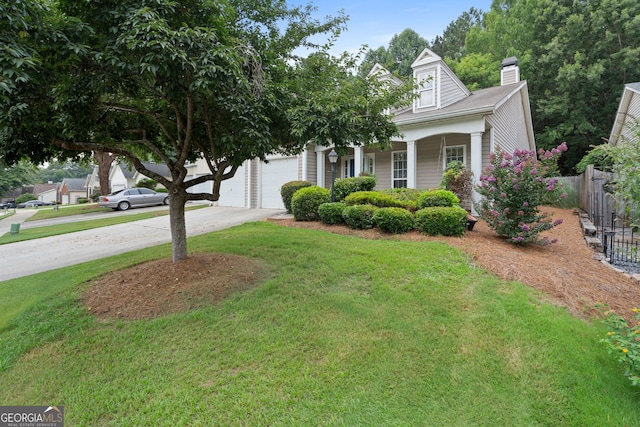 377 Avian Forest Dr, Stockbridge, GA 30281 - view of front facade featuring concrete driveway, a porch, a chimney, and an attached garage
