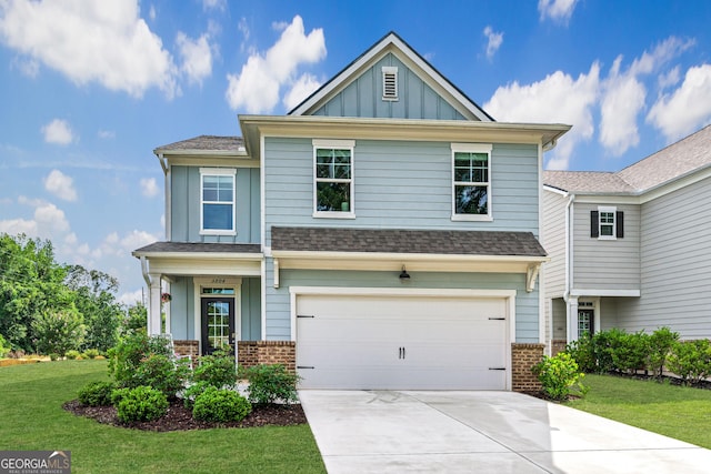 5804 Screech Owl Dr, Flowery Branch, GA 30542 - craftsman-style home featuring board and batten siding, brick siding, concrete driveway, a front yard, and an attached garage