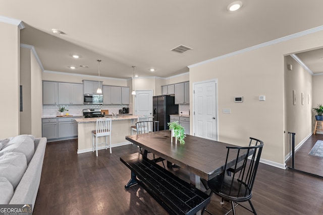5804 Screech Owl Dr, Flowery Branch, GA 30542 - dining area with ornamental molding, recessed lighting, and dark wood-style floors