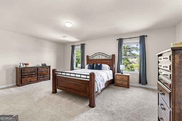 5804 Screech Owl Dr, Flowery Branch, GA 30542 - bedroom with multiple windows and light carpet