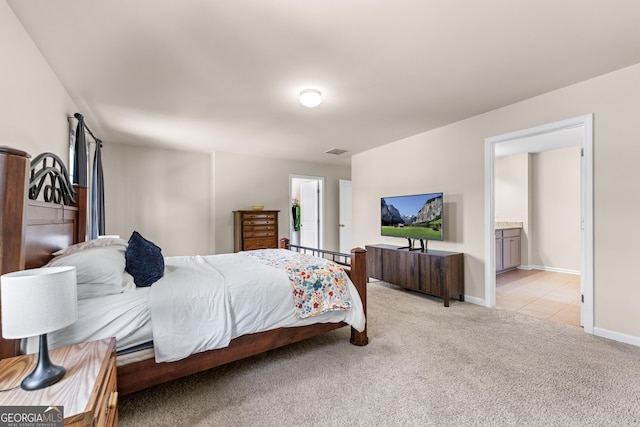 5804 Screech Owl Dr, Flowery Branch, GA 30542 - bedroom with light carpet and ensuite bathroom
