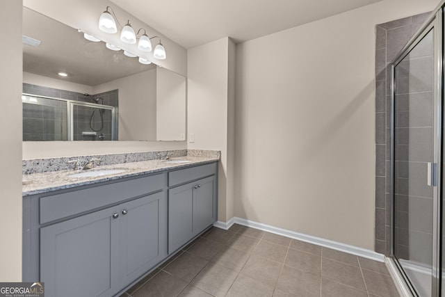 5804 Screech Owl Dr, Flowery Branch, GA 30542 - full bathroom with double vanity, a shower stall, and tile patterned flooring