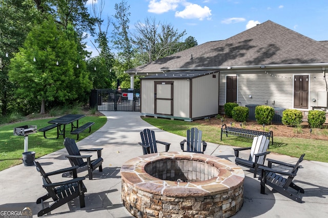 5804 Screech Owl Dr, Flowery Branch, GA 30542 - view of patio featuring an outdoor fire pit and a storage unit
