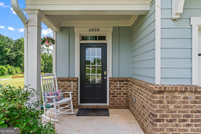 5804 Screech Owl Dr, Flowery Branch, GA 30542 - property entrance with covered porch and brick siding
