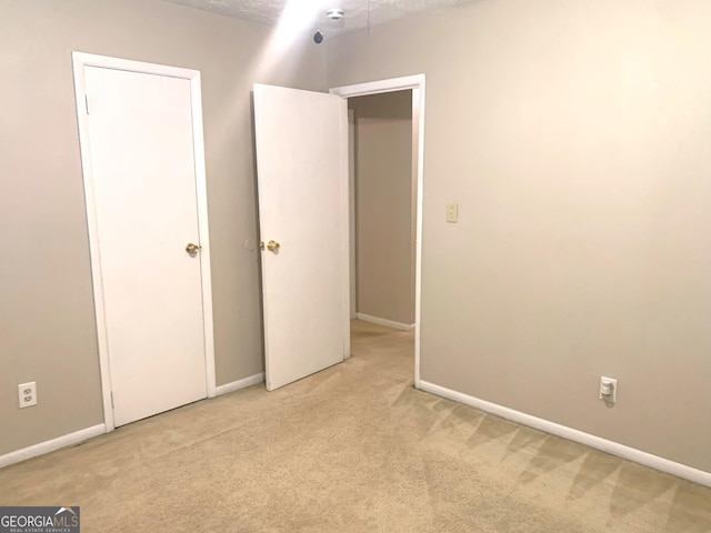 10178 Top Tree Ct, Jonesboro, GA 30238 - unfurnished bedroom with light carpet and baseboards