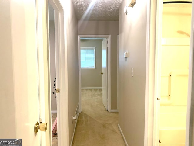 10178 Top Tree Ct, Jonesboro, GA 30238 - hallway with light carpet and a textured ceiling