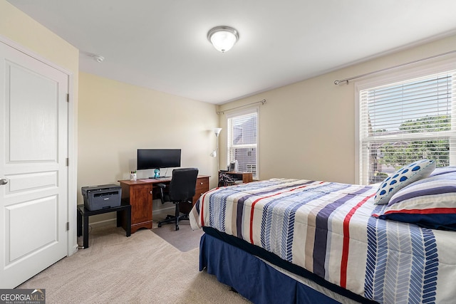 8295 Village Pl, Suwanee, GA 30024 - bedroom featuring light carpet, multiple windows, and an office area