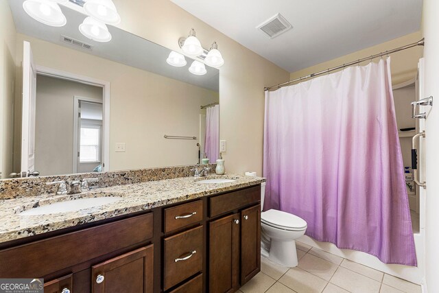 8295 Village Pl, Suwanee, GA 30024 - full bath featuring tile patterned flooring, double vanity, and shower / bath combination with curtain