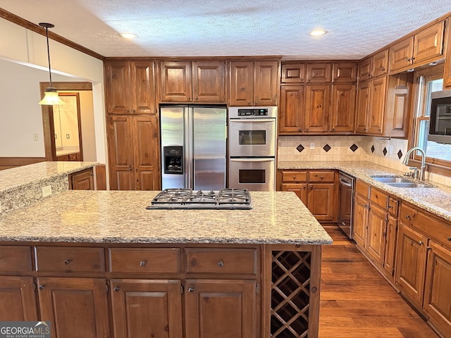 601 Clubland Cir SE, Conyers, GA 30094 - kitchen featuring appliances with stainless steel finishes, dark wood finished floors, brown cabinets, a textured ceiling, and backsplash