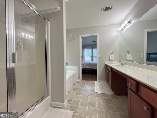 2481 Southhaven Ln, Buford, GA 30519 - ensuite bathroom featuring a bath, a shower with shower door, double vanity, and tile patterned floors
