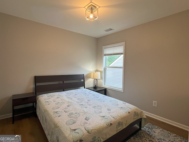 2481 Southhaven Ln, Buford, GA 30519 - bedroom with baseboards and dark wood finished floors