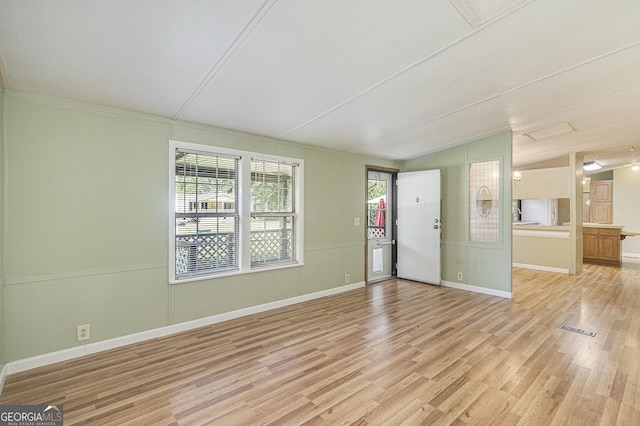 340 Loblolly Rdg, Locust Grove, GA 30248 - unfurnished living room featuring lofted ceiling and light wood-style floors