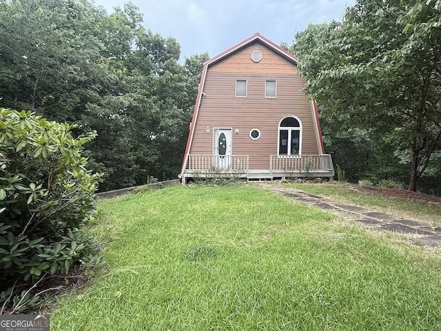 600 Ivory Dr, Baldwin, GA 30511 - back of property with a lawn, a wooden deck, and a gambrel roof