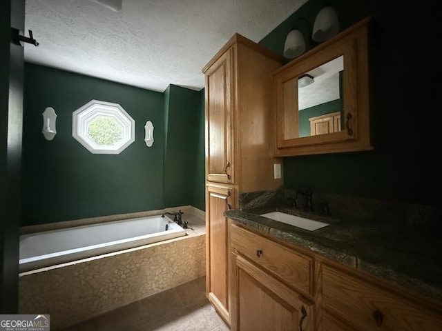 600 Ivory Dr, Baldwin, GA 30511 - bathroom featuring vanity, a bath, and a textured ceiling