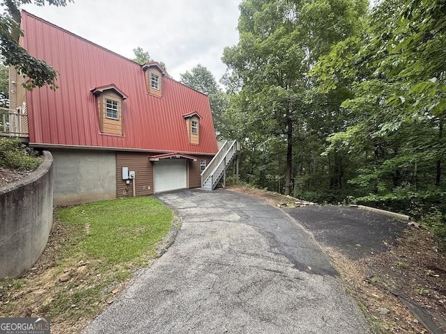 600 Ivory Dr, Baldwin, GA 30511 - view of side of property with a garage, driveway, and stairs