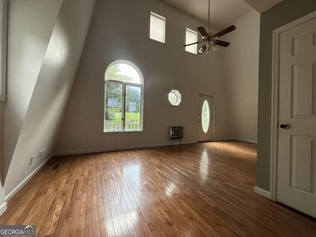 600 Ivory Dr, Baldwin, GA 30511 - unfurnished living room with wood-type flooring, a ceiling fan, and a high ceiling