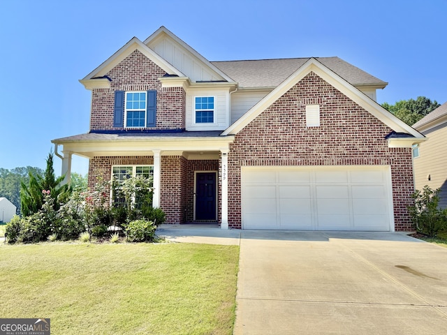 5599 Wheeler Ridge Rd, Auburn, GA 30011 - traditional-style house with concrete driveway, board and batten siding, a front lawn, brick siding, and an attached garage