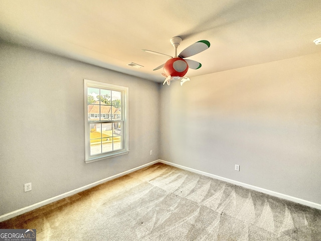 5599 Wheeler Ridge Rd, Auburn, GA 30011 - carpeted empty room featuring a ceiling fan and a smoke detector
