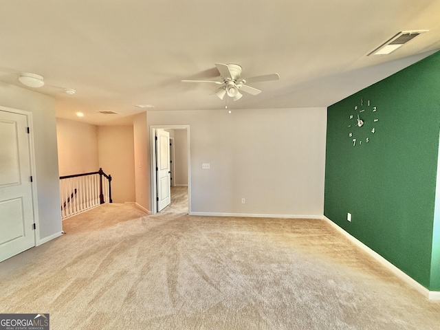 5599 Wheeler Ridge Rd, Auburn, GA 30011 - unfurnished room with light colored carpet and ceiling fan