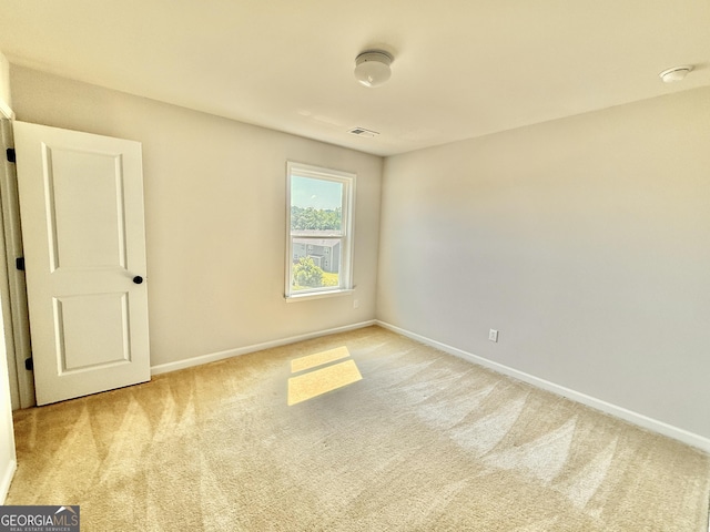 5599 Wheeler Ridge Rd, Auburn, GA 30011 - unfurnished room with light colored carpet and a smoke detector
